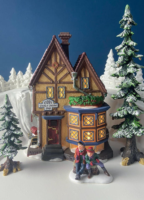 Illuminated Porcelain Christmas Village "Lydby Trunk and Satchel Shop" House by Dept 56. Dickens Village Series.