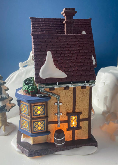 Illuminated Porcelain Christmas Village "Lydby Trunk and Satchel Shop" House by Dept 56. Dickens Village Series.