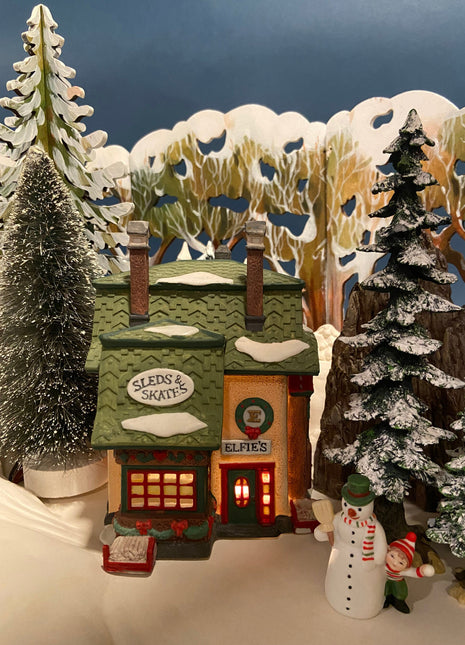 Department 56 Illuminated House. Elfie's Sleds and Skates. North Pole Series. Hand Painted Porcelain Building with Lights. Christmas Decor.