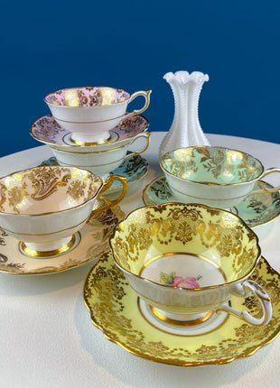 Rare 5 Piece Collection of Pastel Colored Vintage Paragon Cups & Saucers. Stunning Rich Design with Rose Motif and Gold Borders. Fine Dining