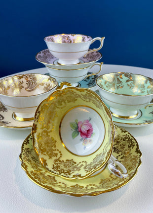 Rare 5 Piece Collection of Pastel Colored Vintage Paragon Cups & Saucers. Stunning Rich Design with Rose Motif and Gold Borders. Fine Dining