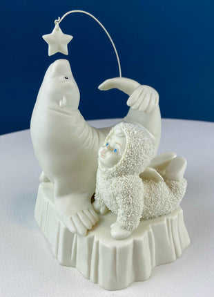 Snow Baby Imitating Seal Trying to Reach a Star. Snow Babies Figurine Celebrating Friendship. Department 56 Collectibles. Kids Room.