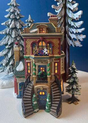 Illuminated Porcelain Christmas Village "Wingham Lane Parrot Seller" House" by Dept 56. and Woman Holding Bird Cage, Dickens Village, 1999.