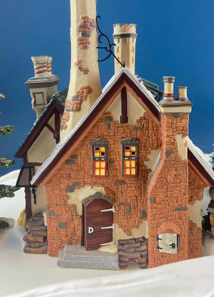 Illuminated Porcelain Christmas Village "Wingham Lane Parrot Seller" House" by Dept 56. and Woman Holding Bird Cage, Dickens Village, 1999.