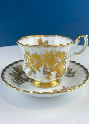 Vintage White and Gold Cup and Saucer. Royal Albert "Golden Rose. " Fine Bone China. Hosting Necessities. Tea Party. Collectibles.