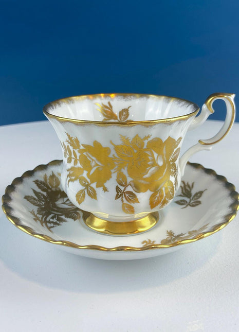 Vintage White and Gold Cup and Saucer. Royal Albert "Golden Rose. " Fine Bone China. Hosting Necessities. Tea Party. Collectibles.