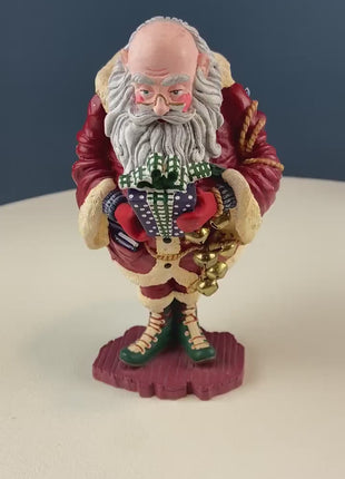 Vintage Jolly Old Elf with Gifts & Bells by Dept. 56. Santa Figurine. Christmas Decoration. Holiday Celebration. Retail or Home Decor.