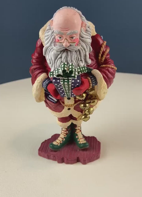 Vintage Jolly Old Elf with Gifts & Bells by Dept. 56. Santa Figurine. Christmas Decoration. Holiday Celebration. Retail or Home Decor.