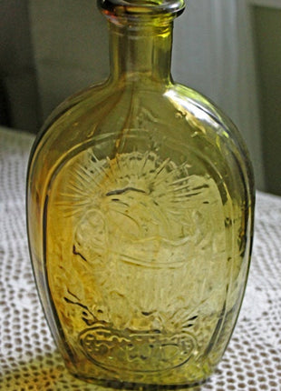 Vintage Decorative Bottle in Amber Color with Embossed Ship, Eagle, Initial TWD, and Franklin.