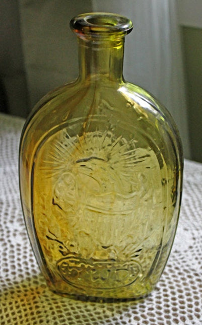 Vintage Decorative Bottle in Amber Color with Embossed Ship, Eagle, Initial TWD, and Franklin.