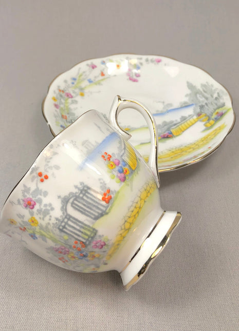 Rosedale Teacup with Saucer by Royal Albert , 7224.   White , Gray , Yellow , Red.  Made in England.