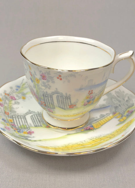Rosedale Teacup with Saucer by Royal Albert , 7224.   White , Gray , Yellow , Red.  Made in England.