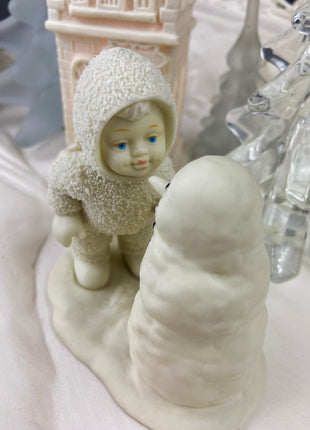 Village Accessories by Department 56. Snow Babies. Snow Baby Playing with Snowman.