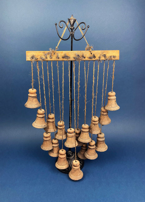 Collection of Hanging Bells.  Seventeen Rustic Clay Bells Suspended from Piece of Wood.  Wall Hanging.