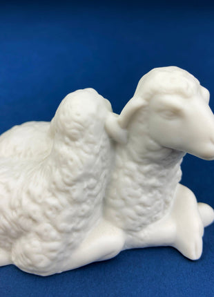 Vintage Avon Nativity Figurine. Cuddling Lambs.  White, Bisque Porcelain.  Beautifully Detailed Statuette.  Highly Collectible.