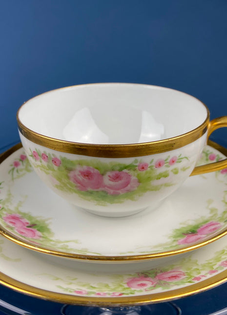 Antique Bavarian Porcelain Teacup, Saucer, and Small Dessert Plate. Hand-Painted Trio. Garlands of Roses. J & C Ovid. Made in Germany.