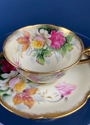 Regency Tea Cup and Saucer. Antique Hand-Painted Porcelain Cup and Saucer. Peach with Wild Flower Bouquet Motif. Made in England.