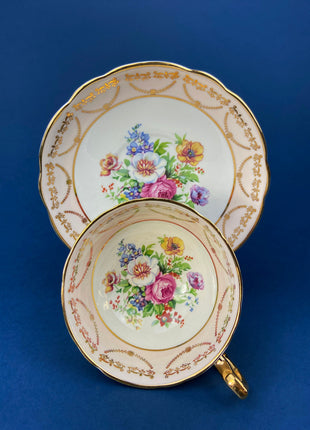 Regency Tea Cup and Saucer. Antique Hand-Painted Porcelain Cup and Saucer. Peach with Wild Flower Bouquet Motif. Made in England.