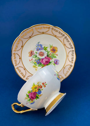 Regency Tea Cup and Saucer. Antique Hand-Painted Porcelain Cup and Saucer. Peach with Wild Flower Bouquet Motif. Made in England.