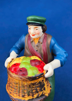 Christmas Village Accessories by Dept. 56. Porcelain, hand Painted Fruit Vendor. Chelsea Market Fruit Monger and Cart. Holiday Celebration.