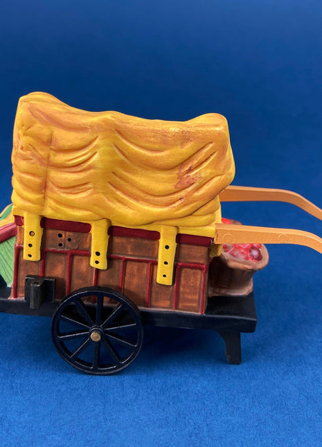 Christmas Village Accessories by Dept. 56. Porcelain, hand Painted Fruit Vendor. Chelsea Market Fruit Monger and Cart. Holiday Celebration.