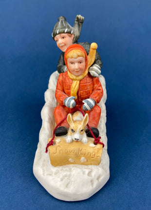 Kids & Dog on Sled Porcelain Figurine. Christmas. Downhill Racer. Inspired by Norman Rockwell. Museum Collections. Snow King. Collectibles.