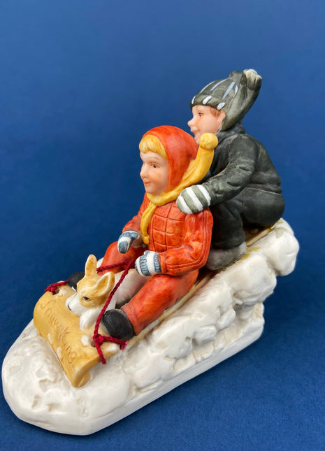 Kids & Dog on Sled Porcelain Figurine. Christmas. Downhill Racer. Inspired by Norman Rockwell. Museum Collections. Snow King. Collectibles.