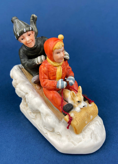 Kids & Dog on Sled Porcelain Figurine. Christmas. Downhill Racer. Inspired by Norman Rockwell. Museum Collections. Snow King. Collectibles.