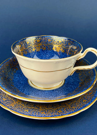 Vintage Aynsley Tea Cup Trio. Cup, Saucer, and Small 6" Dessert Plate. Blue and Gold, with Hand Painted Bouquet of Flowers. Fine Bone China.