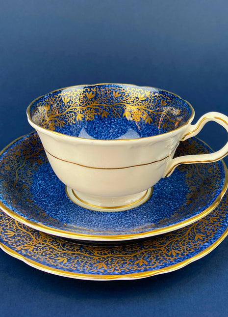 Vintage Aynsley Tea Cup Trio. Cup, Saucer, and Small 6" Dessert Plate. Blue and Gold, with Hand Painted Bouquet of Flowers. Fine Bone China.