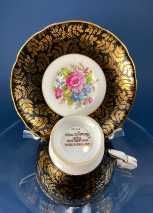Royal Staford Cup and Saucer. Black with Gold Leaves. Hand Painted Flower Bouquet Inside of Cup and on the Plate.