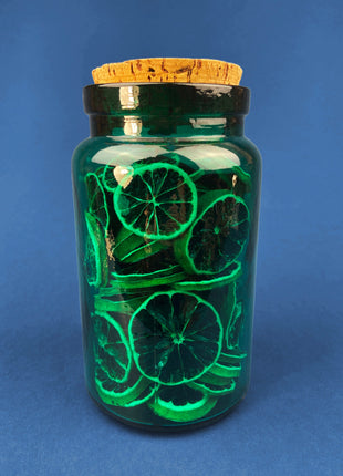 Green Glass Storage Jar with Dried Orange Slices. Large, Deep Green Glass Canister with Cork Lid. Countertop Container or Cookie Jar.