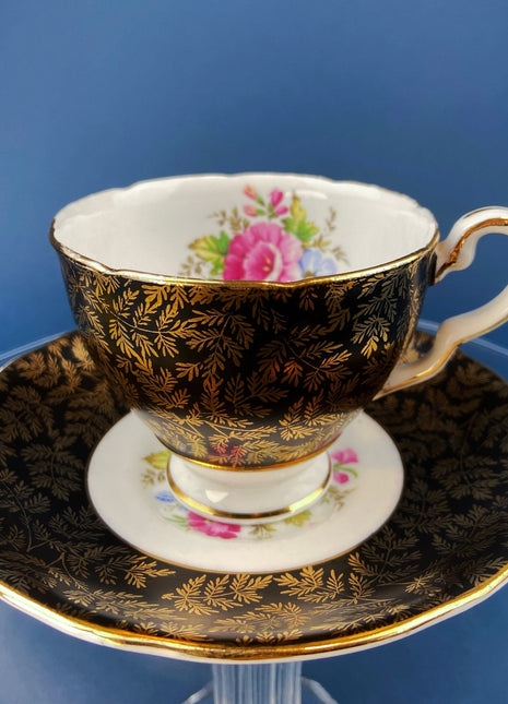 Royal Staford Cup and Saucer. Black with Gold Leaves. Hand Painted Flower Bouquet Inside of Cup and on the Plate.