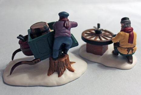 Porcelain Figurines by Department 56. Bradford Wheelwright 5818-1, Wheel Repair Men.