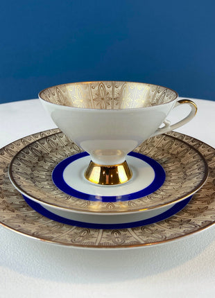 Antique Bavarian Porcelain Tea Trio. Z and Co, Tirschenreuther. Cup, Saucer, and Dessert Plate in Rich Gold and Blue. Modern Floral Pattern.