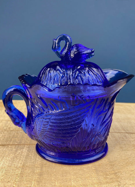 Cobalt Blue Creamer with Swan-Shaped Handle and Lid. Glass Creamer with Embossed Reed and Swans. Collectible Glass.