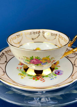 Regency Tea Cup and Saucer. Antique Hand-Painted Porcelain Cup and Saucer. Peach with Wild Flower Bouquet Motif. Made in England.