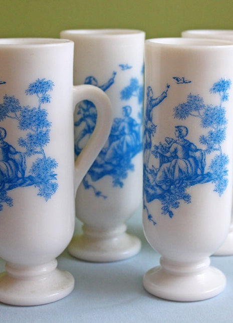 Vintage milk glass shooters with romantic scene motif