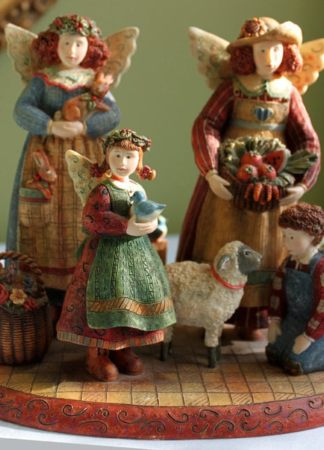Angels Figurines. Porcelain Figurines Hand Made and Painted from Painting of Susan Winget.   Everyday Angels.