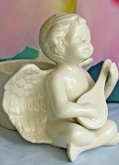 Porcelain Ivory Colored Figurine of Cherub Playing Banjo
