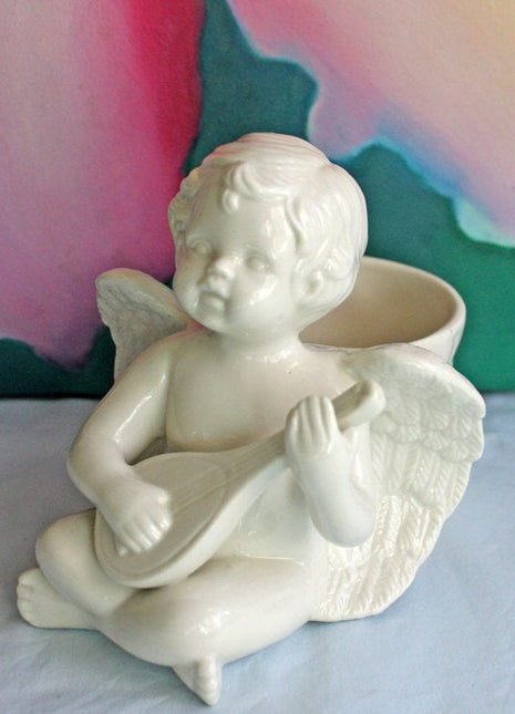 Porcelain Ivory Colored Figurine of Cherub Playing Banjo
